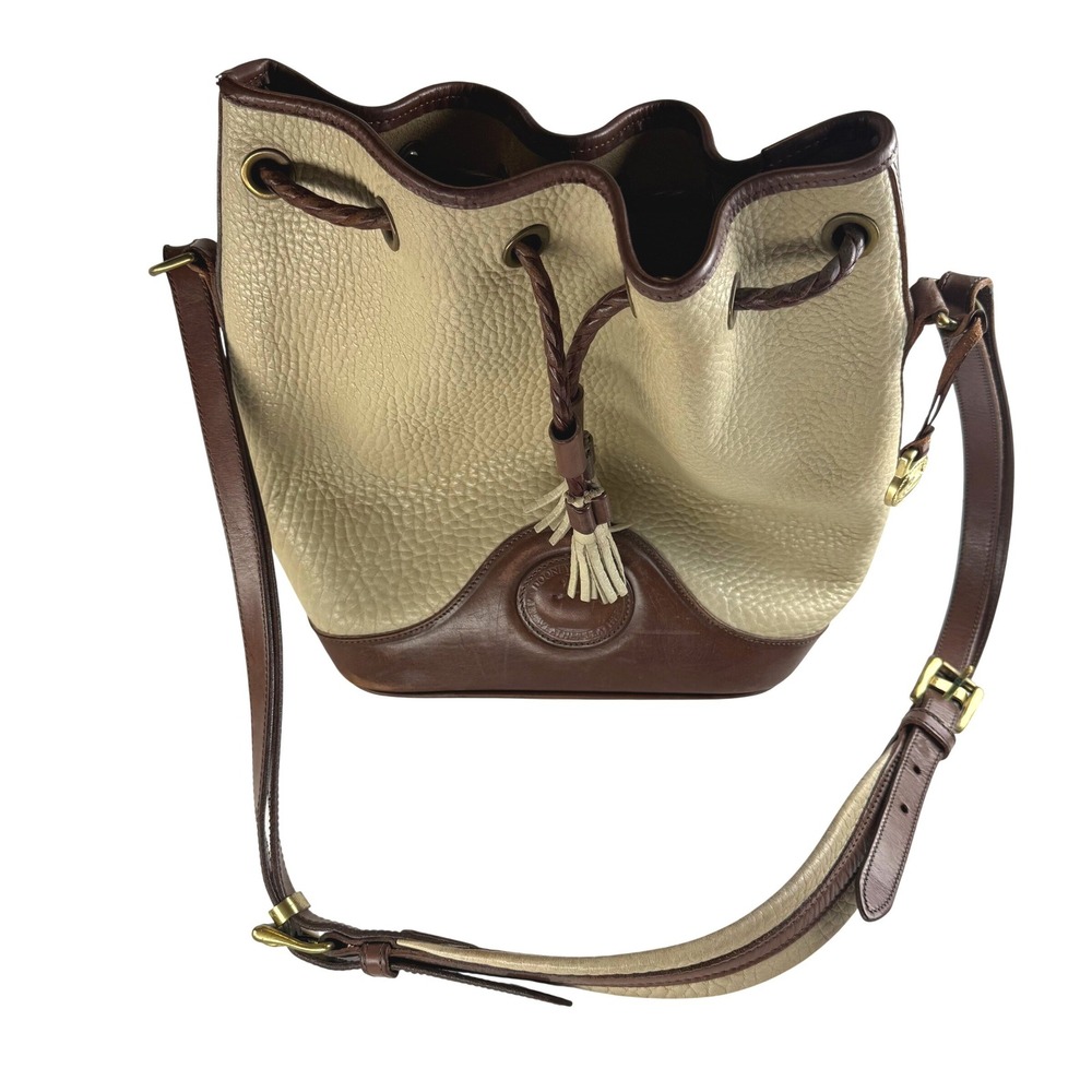 Dooney & Bourke All Weather Leather Bucket Drawstring Bag Tassel Beige Brown